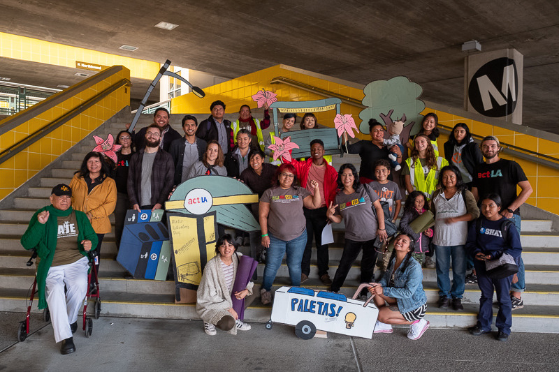 A group of ACT Los Angeles members at a Metro station dressed up in various safety roles